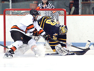 Eric Hartzell (Quinnipiac - 33) makes a save on Rob Kleebaum (Princeton - 39).  Hartzell stopped 34 of 35 shots to help Quinnipiac earn a 1-1 tie with Princeton at Hobey Baker Rink, in Princeton, NJ. (Shelley M. Szwast)