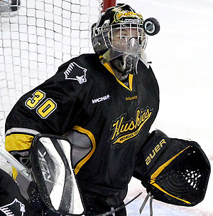 Michigan Tech goalie Josh Robinson gets an up close view of the puck during the second period. UNO defeated Michigan Tech 5-2 Thursday night at Qwest Center Omaha. (Photo by Michelle Bishop) (Michelle Bishop)