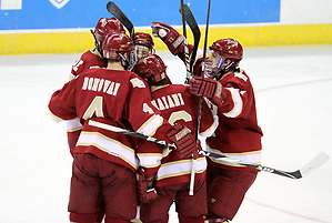 Denver celebrates Drew Shore's goal during the first period. Denver beat Nebraska-Omaha 4-2 Saturday night at Qwest Center Omaha. (Photo by Michelle Bishop) (Michelle Bishop)