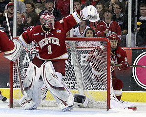 Denver goalie Sam Brittain looks to glove a floating puck during the third period. Denver beat Nebraska-Omaha 4-2 Saturday night at Qwest Center Omaha. (Photo by Michelle Bishop) (Michelle Bishop)