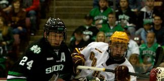 6 Nov 11: Ben Blood (North Dakota 24), Aaron Dell (North Dakota - 32), Erik Haula (Minnesota - 19) The University of Minnesota Golden Gophers host the University of North Dakota Fighting Sioux in a WCHA matchup at Mariucci Arena in Minneapolis, MN. (Jim Rosvold)