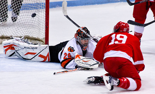 Jillian Saulnier (Cornell - 19) takes a shot on net, but the referee already signaled that Rachel Weber (Princeton - 29) had frozen the puck. Cornell defeated Princeton 3-1 at Hobey Baker Rink in Princeton, N.J. (Shelley M. Szwast)