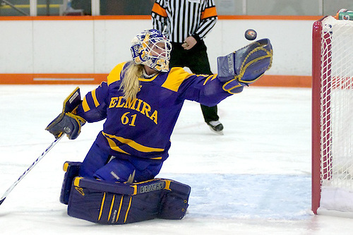 Elmira's Lauren Sullivan reaches back to make one of her 13 saves against RIT (2012 Omar Phillips)