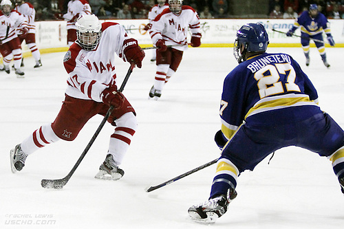 8 DEC 2012: Austin Czarnik (Miami - 7), Matt Bruneteau (LSSU - 27)  The Lake Superior State Lakers shut out the Miami RedHawks 1-0 at Steve Cady Arena in Oxford, OH.  (USCHO - Rachel Lewis) (Tim Brule)