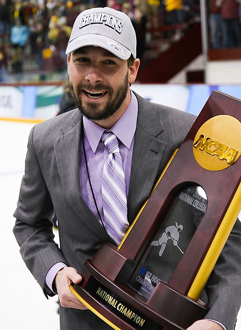 Minnesota Head Coach with the Walnut & Bronze following the 2013 NCAA Women's Frozen Four Championship game at Ridder Arena in Minneapolis on March 24, 2013... (Ryan Coleman/Ryan Coleman, USCHO.com)