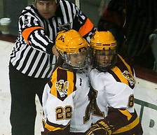 Amanda Kessel (22) and Hannah Brandt (8) celebrate Kessel's second goal of the evening and 36th of the year in the Gophers' 5-0 rout of Minnesota-Duluth on February 1, 2013 at Ridder Arena....Unauthorized reproduction of d3photography.com photos is strictly forbidden (resale, reproduction);.use in advertising (for profit or at a loss) is a violation of the Student-Athlete's eligibility to compete...NCAA Bylaw 12.5.2.2 - Use of a Student-Athlete's Name or Picture Without Knowledge or Permission..If a student-athlete's name or picture appears on commercial items (e.g., T-shirts, sweatshirts, serving trays, playing cards, posters) or is used to promote a commercial product sold by an individual or agency without the student-athlete's knowledge or permission, the student-athlete (or the institution acting on behalf of the student-athlete) is required to take steps to stop such an activity in order to retain his or her eligibility for intercollegiate athletics. Such steps are not required in cases in which a student-athlete's photograph is sold by an individual or agency (e.g., private photographer, news agency) for private use. (Revised: 1/11/97, 5/12/05) (Ryan Coleman/Ryan Coleman, d3photography.com)