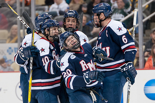 Robert Morris players celebrate a goal by Timmy Moore (20 - Robert Morris) (Omar Phillips)