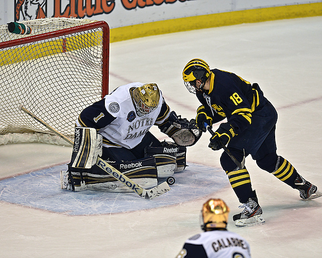 Notre Dame goaltender Steven Summerhays (1) makes an incredible save against Michigan forward Andrew Copp (18)   (Eric Kelley/Eric Kelley, d3photography.com)