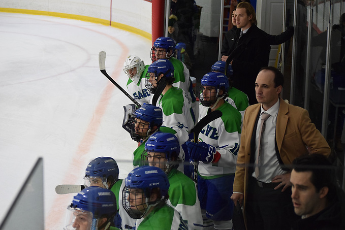 Zech Klann of Salve Regina behind the bench (Salve Regina Athletics)