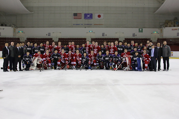 Saint John's players with Toyko team. (Saint John's Athletics)