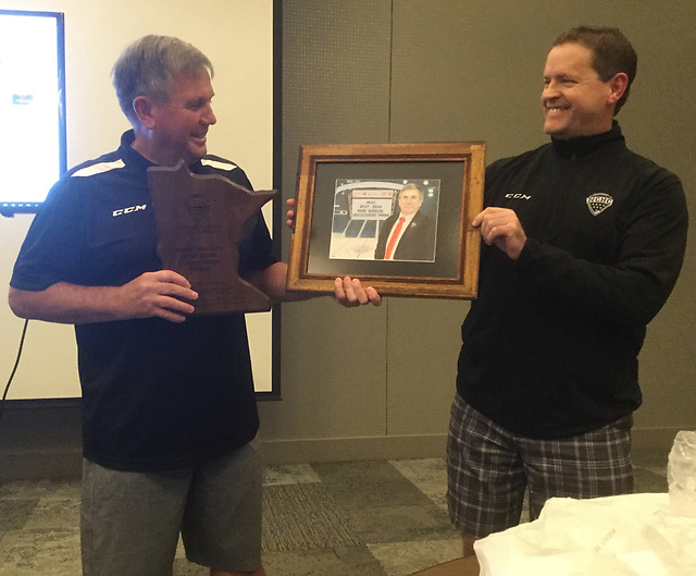 Don Adam (right) presents the Mark Rudolph Award to Ron Foyt. (photo: NCHC)