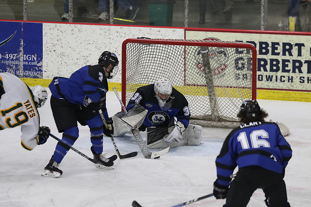 Hunter Vorva anchors Marian in net. (Larry Radloff/Larry Radloff, d3photography.com)