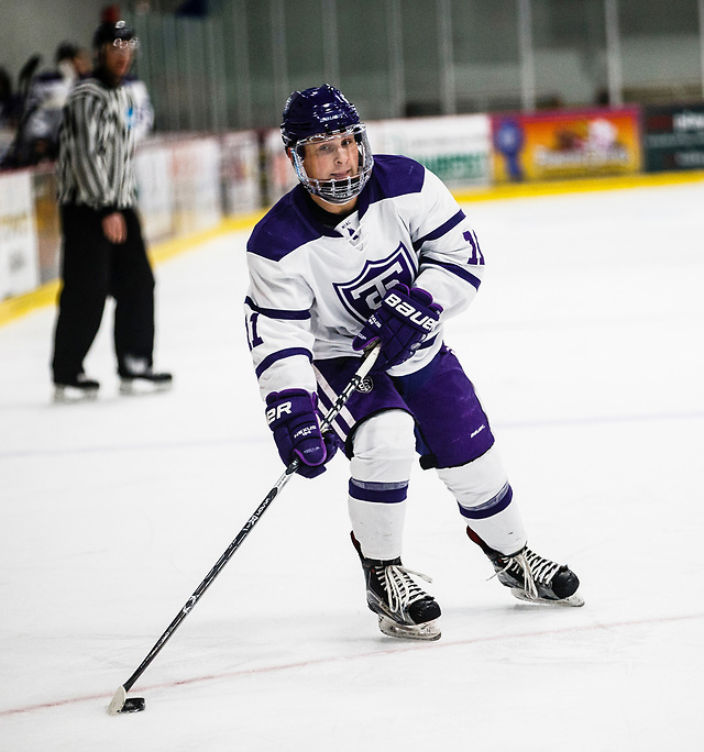 Johnny Panvica skates with the puck during a men's ice hockey game against the University of Wisconsin-Eau Claire on November 9, 2017, in the St. Thomas Ice Arena in Mendota Heights. UST won the game by a final score of 5-3. (Mark Brown/University of St. Thomas)