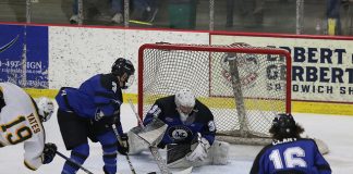 Hunter Vorva anchors Marian in net. (Larry Radloff/Larry Radloff, d3photography.com)