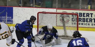 Hunter Vorva anchors Marian in net. (Larry Radloff/Larry Radloff, d3photography.com)