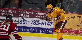 11 Dec 15: Suvi Ollikainan (St. Cloud -20), Kelly Pannek (Minnesota - 19). The University of Minnesota Golden Gophers play against the St. Cloud State University Huskies in the U.S. Hockey Hall of Fame Game at the Roseville Skating Center in Roseville, MN. (Jim Rosvold)