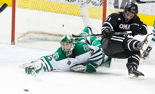 Cam Johnson (North Dakota-33) Ryan Galt (University Nebraska Omaha-21) 17 Feb.25  University Nebraska Omaha and the University of North Dakota meet in a NCHC game at the Ralph Engelstad Arena in Grand Forks, ND (Bradley K. Olson)