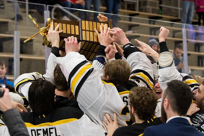 AIC players celebrate winning the 2019 Atlantic Hockey championship (2019 Omar Phillips)