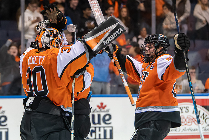 Logan Drackett (30 - RIT) and Darren Brady (23 - RIT) celebrate a 4-0 win over Merrimack (Omar Phillips 2019)