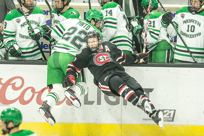 Clark Kuster (SCSU-2)  Shane Pinto (North Dakota-22) 2019 November 22 St. Cloud State University and University North Dakota meet in NCHC conference game at the Ralph Engelstad Arena Grand Forks, ND (Bradley K. Olson)