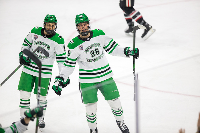 Westin Michaud (North Dakota-11) Judd Caulfield ((North Dakota-28) 2019 November 22 St. Cloud State University and University North Dakota meet in NCHC conference game at the Ralph Engelstad Arena Grand Forks, ND (Bradley K. Olson)